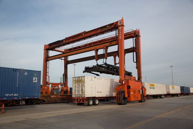 A BNSF intermodal crane operates at Alliance Intermodal Facility.