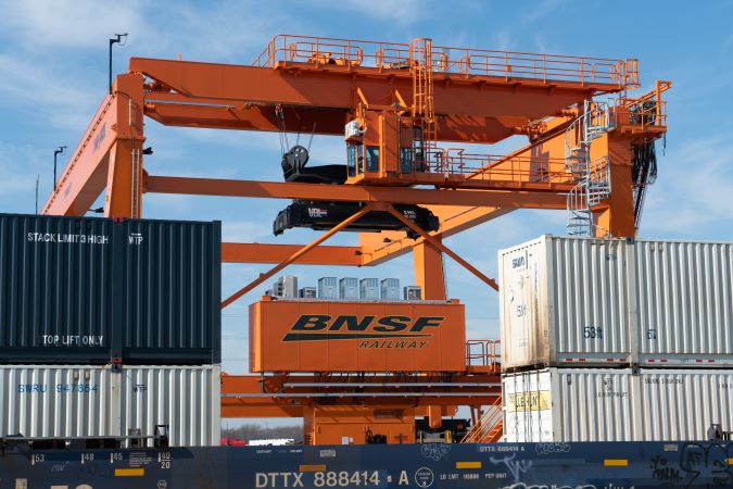 A BNSF intermodal crane operates at Alliance Intermodal Facility.